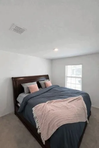 a view of a livingroom with workspace and a couch