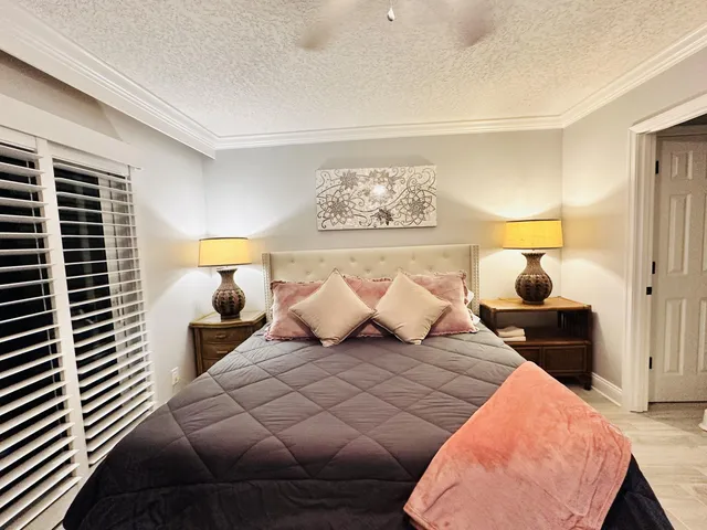 a bedroom with a bed and window