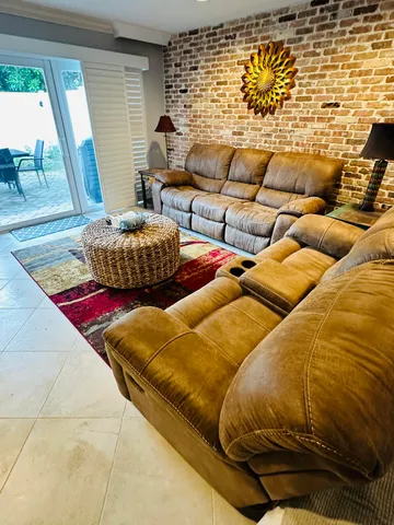 a living room with blue lights with a couch