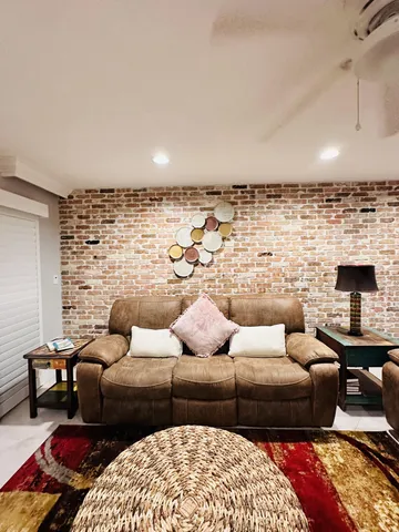 a living room with furniture and a fireplace