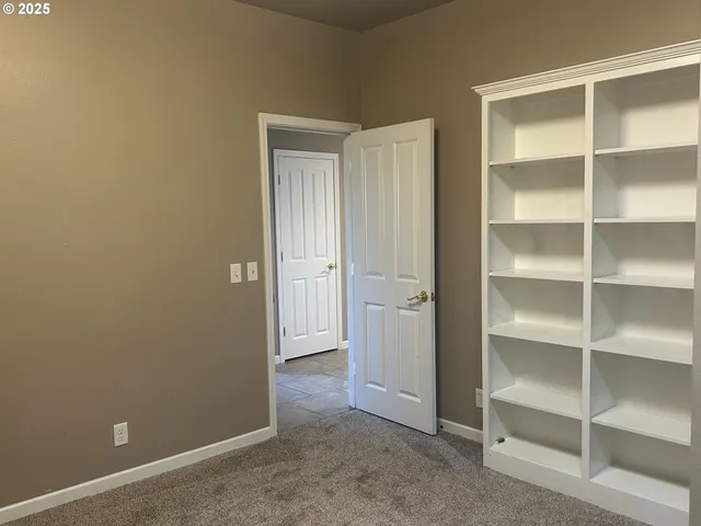 a view of an empty room with empty racks