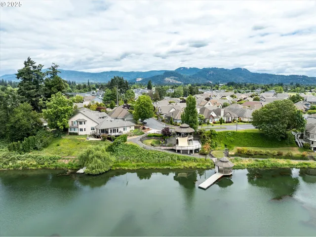 an aerial view of a houses with lake view