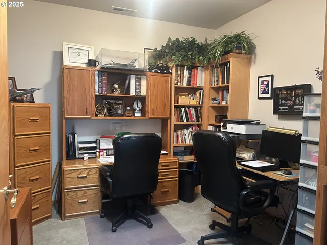 a view of a workspace with furniture