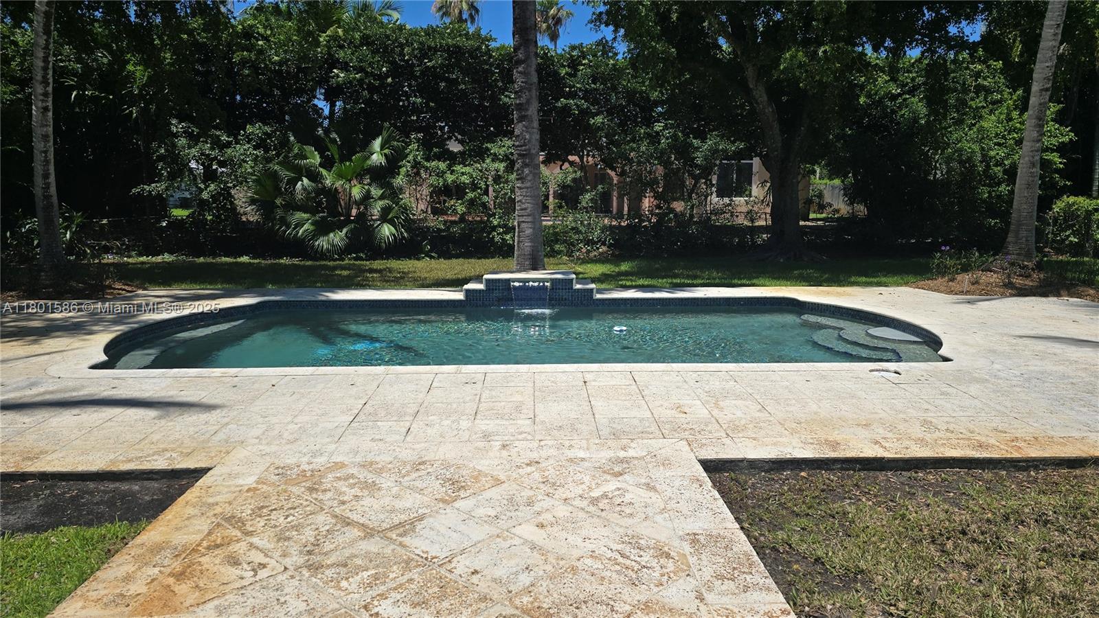 8700 Southwest 64th Avenue Pinecrest, FL 33156 - Photo 10 of 11 a view of swimming pool with a yard