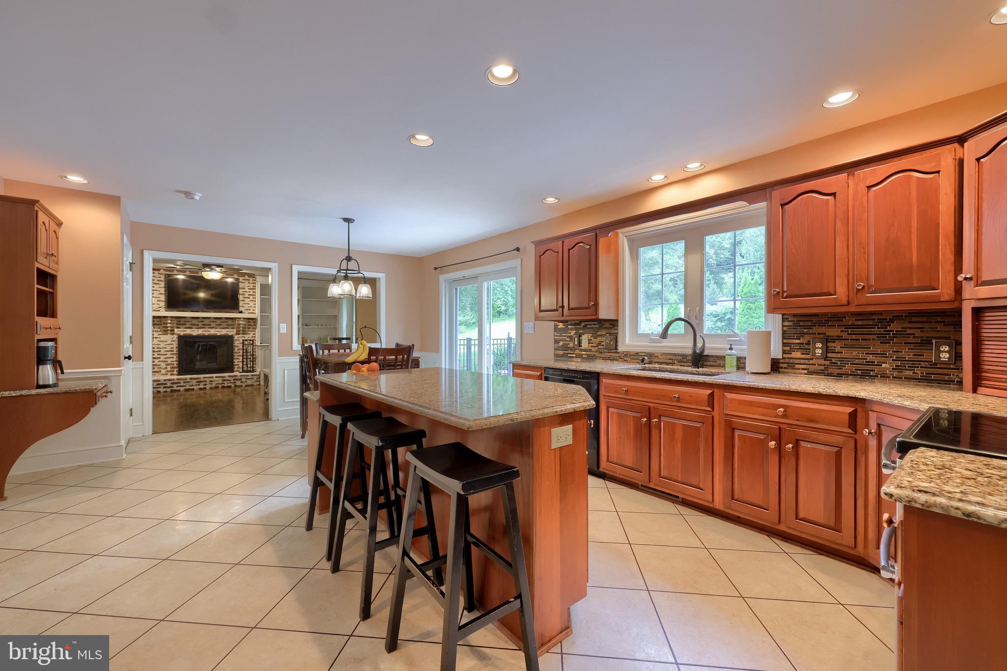 2504 Brookside Drive Lancaster, PA 17601 - Photo 17 of 53 a kitchen with stainless steel appliances granite countertop table chairs sink and cabinets