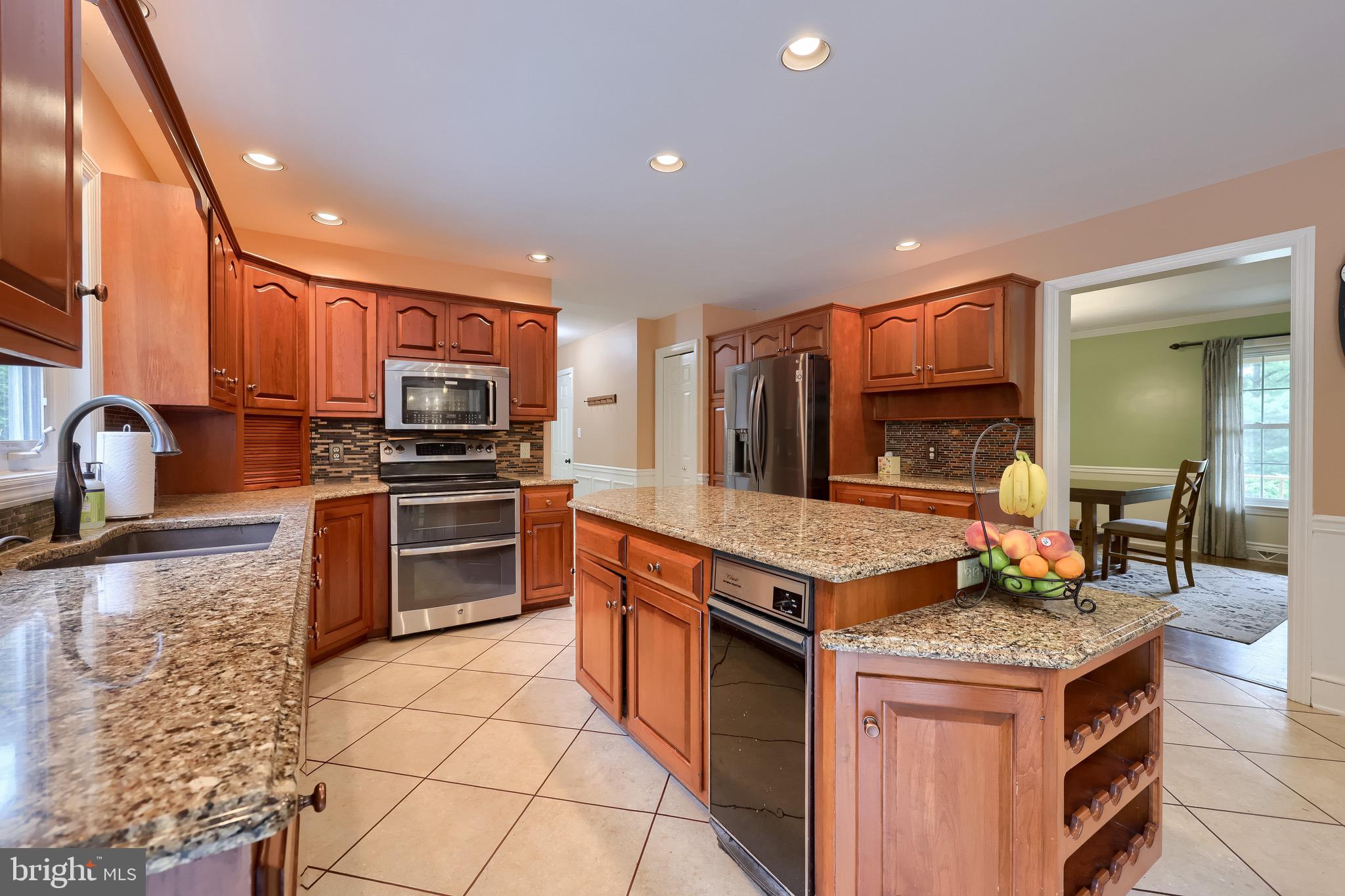 2504 Brookside Drive Lancaster, PA 17601 - Photo 20 of 53 a kitchen with stainless steel appliances granite countertop a stove and a sink