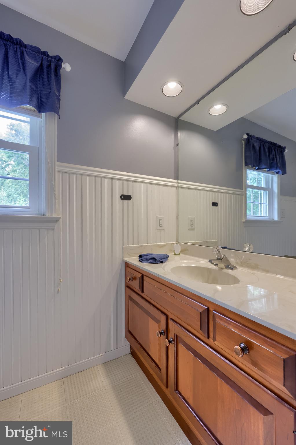2504 Brookside Drive Lancaster, PA 17601 - Photo 45 of 53 a bathroom with a granite countertop sink and a mirror