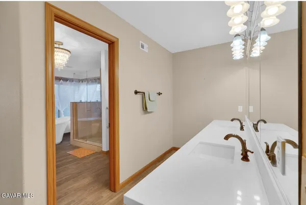 a bathroom with a tub and a shower