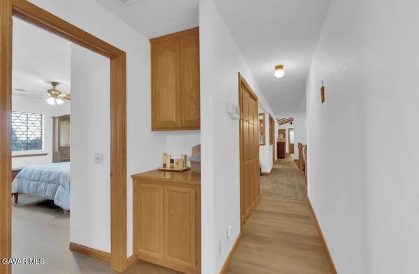 a view of hallway with livingroom and furniture