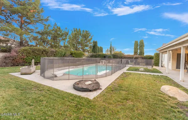 a view of a swimming pool with a patio