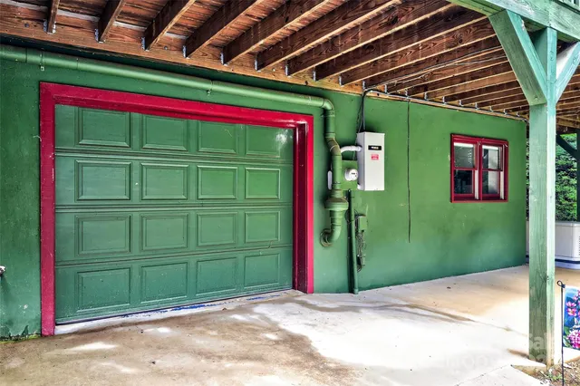 a wooden bench sitting in front of a building