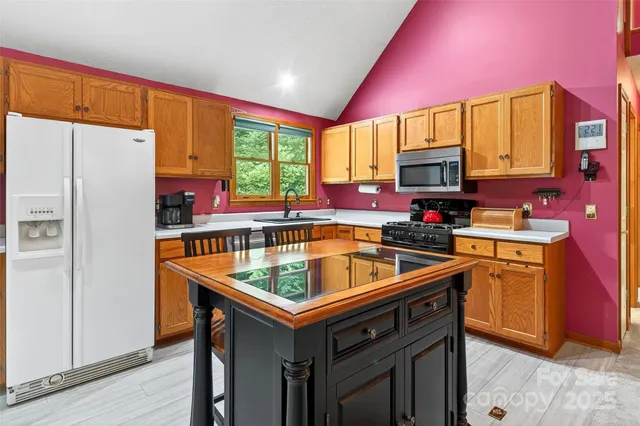 a living room with furniture a ceiling fan and a rug