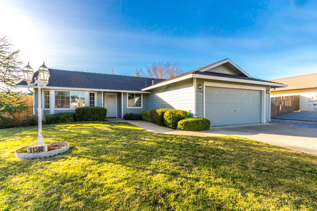 11380 Puffin Way Redding, CA 96003 - Photo 1 of 27 a house view with a swimming pool