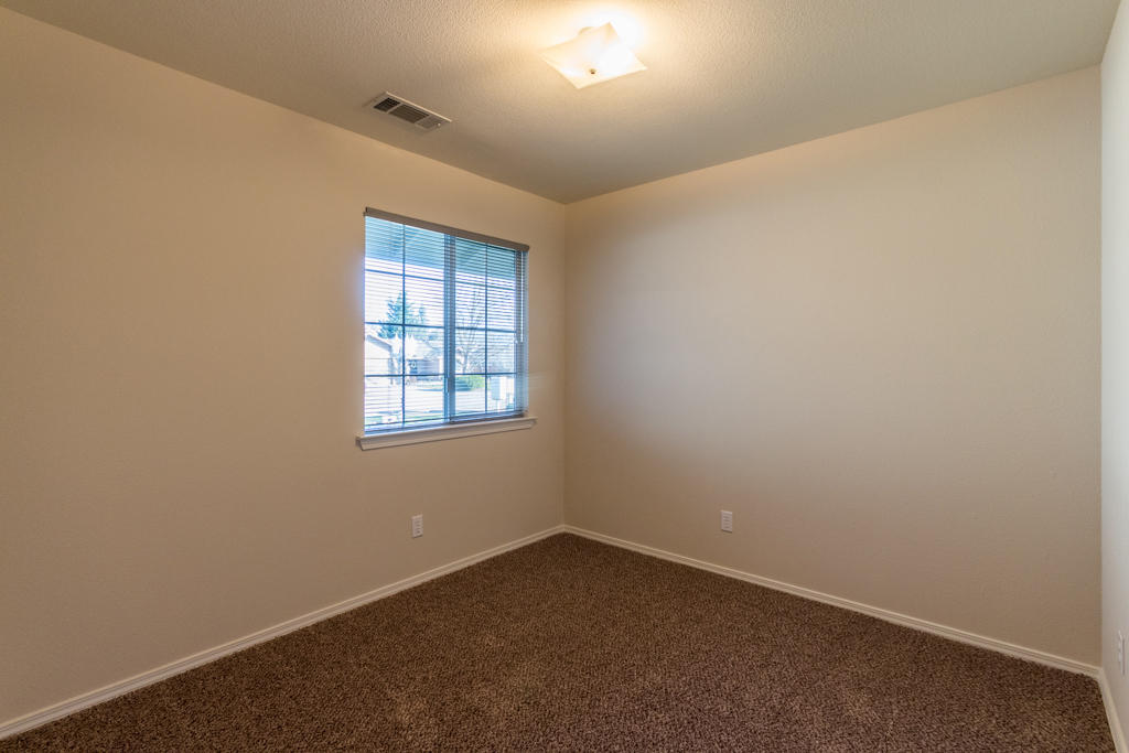 11380 Puffin Way Redding, CA 96003 - Photo 13 of 27 an empty room with a window
