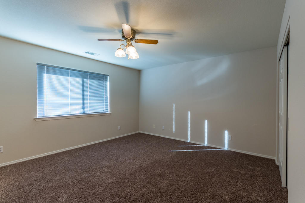 11380 Puffin Way Redding, CA 96003 - Photo 14 of 27 a view of a livingroom with a ceiling fan and window