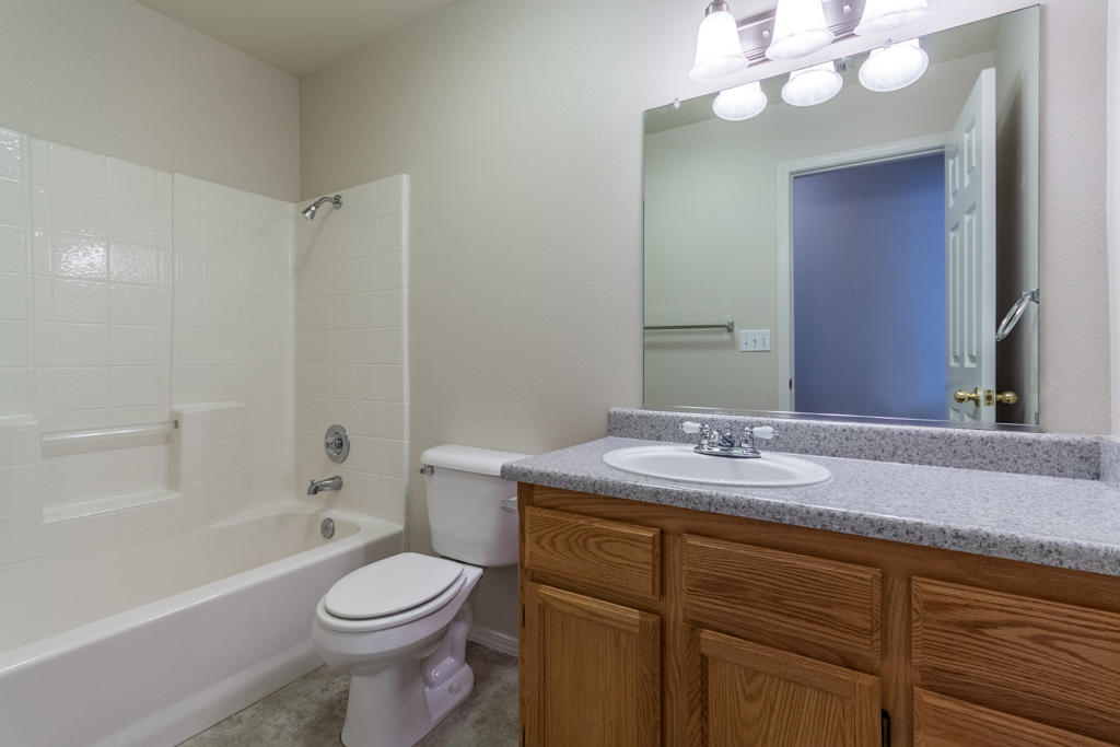 11380 Puffin Way Redding, CA 96003 - Photo 15 of 27 a bathroom with a sink a toilet and shower