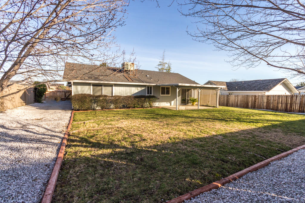 11380 Puffin Way Redding, CA 96003 - Photo 19 of 27 a front view of a house with a yard