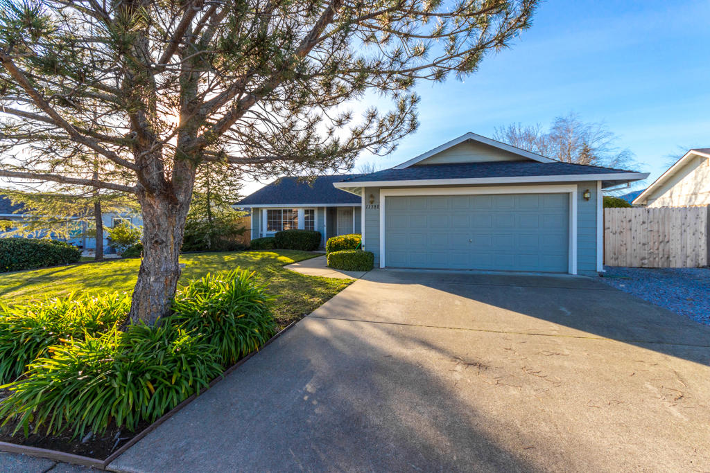 11380 Puffin Way Redding, CA 96003 - Photo 24 of 27 a front view of a house with garden