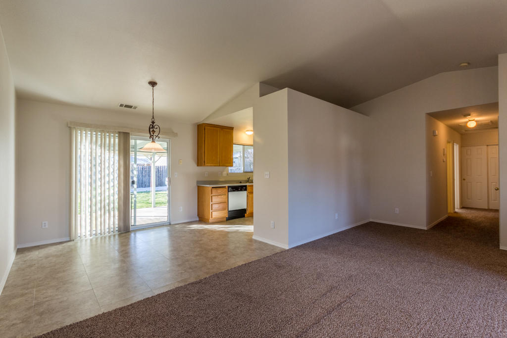 11380 Puffin Way Redding, CA 96003 - Photo 5 of 27 wooden floor in an empty room with a window