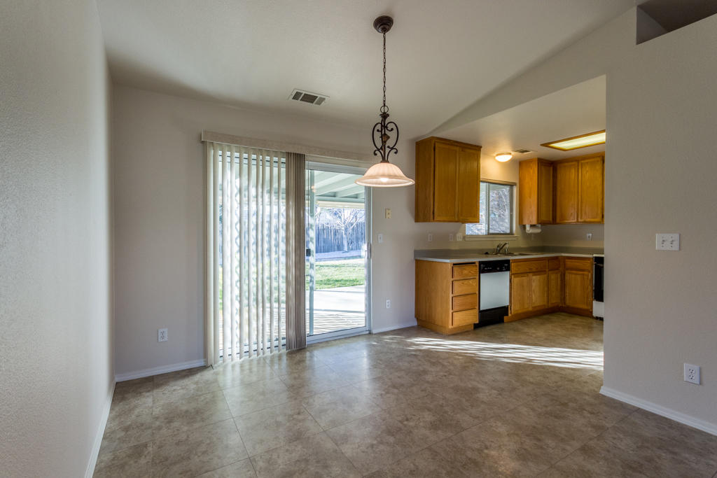 11380 Puffin Way Redding, CA 96003 - Photo 6 of 27 a view of a kitchen with a sink and dishwasher