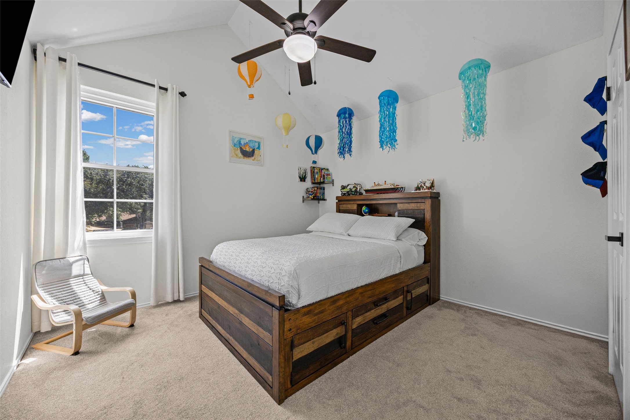 3006 Overland Street Round Rock, TX 78681 - Photo 15 of 29 High vaulted ceilings and soft carpeting create a peaceful atmosphere in this secondary bedroom.
