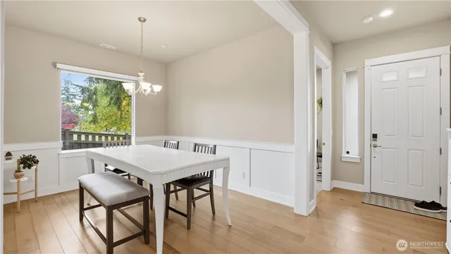 a view of a dining room with furniture window and outside view
