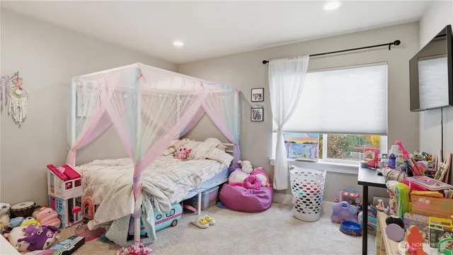 a bedroom with furniture and a bed