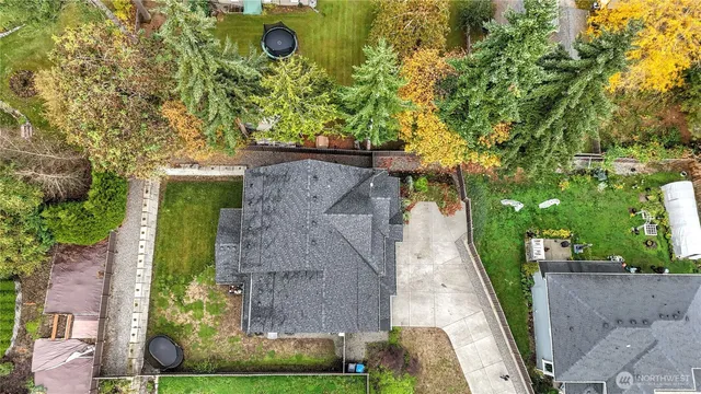 an aerial view of a residential houses with outdoor space
