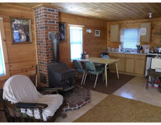 265 Hole In The Wall Road Solon, ME 04979 - Photo 8 of 23 Kitchen. Woodstove keeps everyone comfy