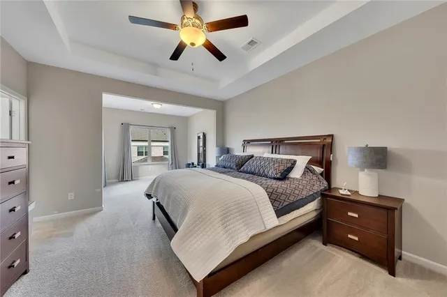 a view of a room with gym equipment and a large window