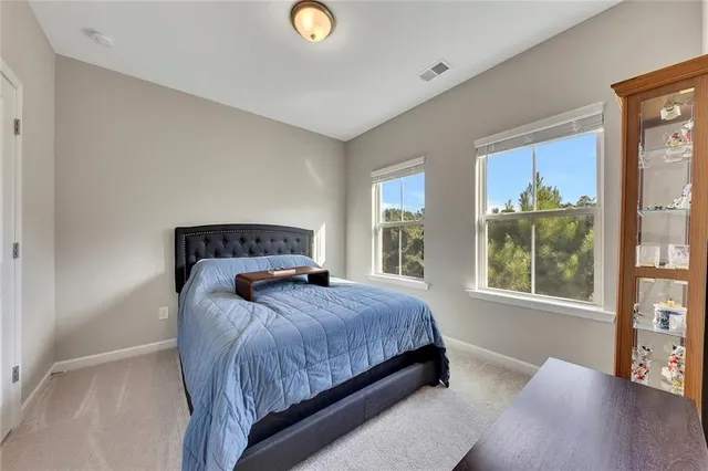 a living room with furniture and a dresser