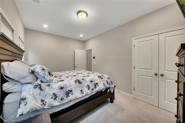 a view of a white house with a yard