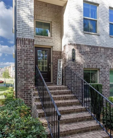 a view of entryway with wooden floor and door