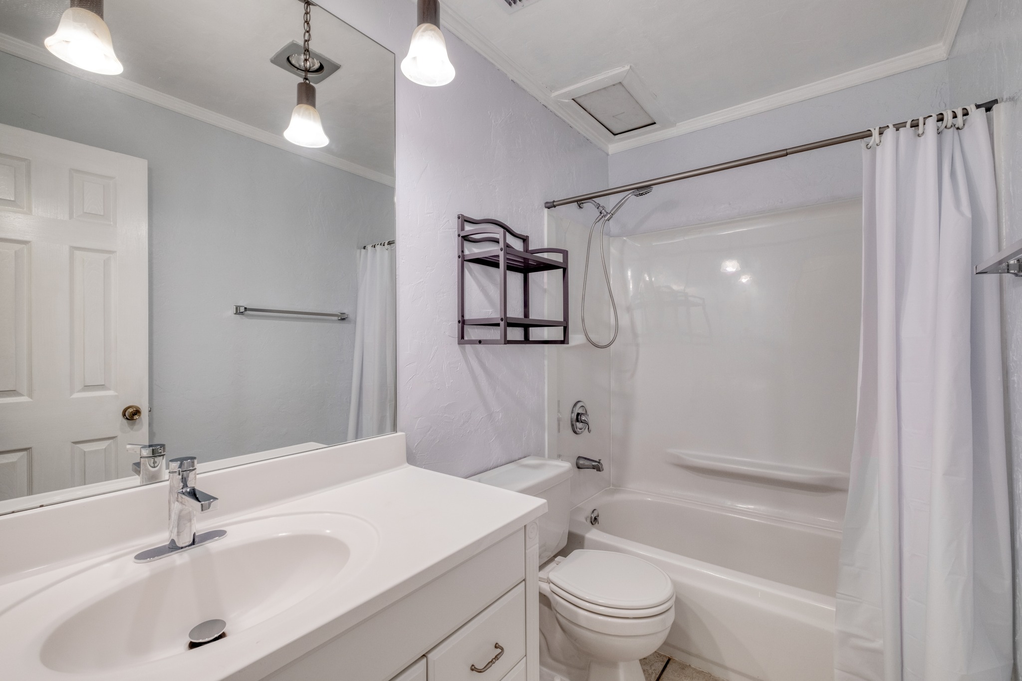 8210 Bent Tree Road, Unit 153 Austin, TX 78759 - Photo 19 of 20 Bathroom featuring a white vanity with integrated sink, chrome faucet, and a large mirror