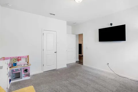 a livingroom with a flat screen tv