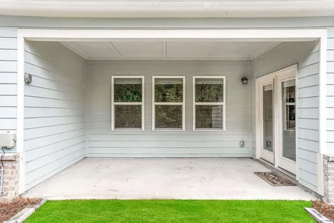 a view of house with backyard