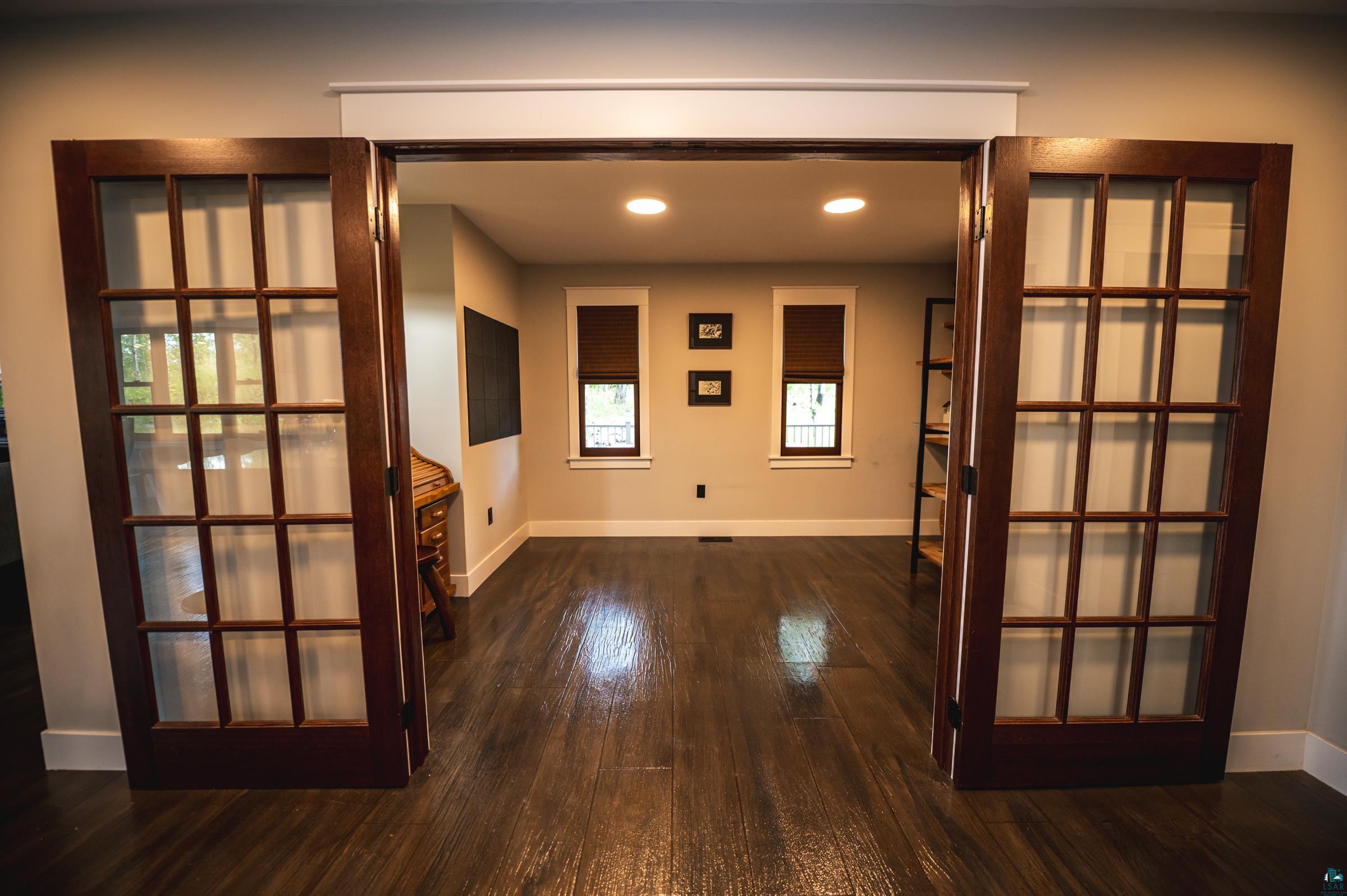 14635 Canadian Border Road Ely, MN 55731 - Photo 79 of 94 Dark wood-finish flooring, recessed lighting, and white trim throughout