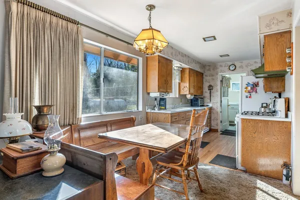 a view of a dining room with furniture window and outside view