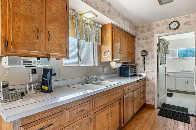 a kitchen with a sink and cabinets