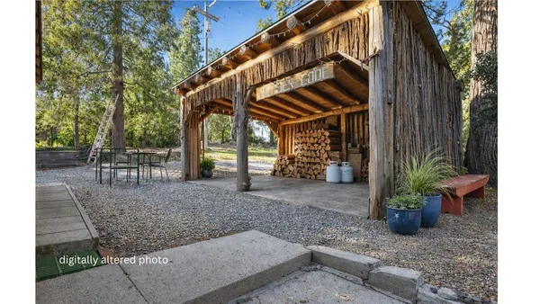 a view of a house with yard and sitting area