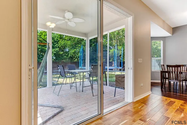 a view of front door and porch with wooden floor