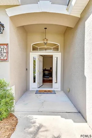 a view of a hallway with a window and a fireplace