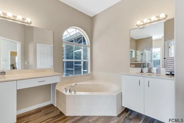 a bathroom with a bathtub and a sink