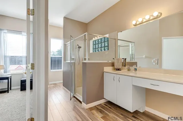 a bathroom with a bathtub and shower
