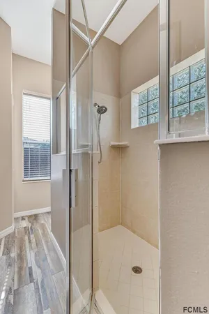 a view of a house with backyard and a tree