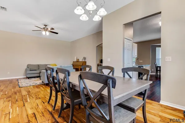 a view of a dining room with furniture