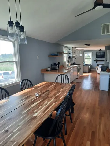 a view of a dining room with furniture window and outside view