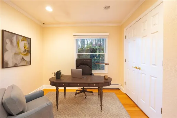 a work room with furniture and a window