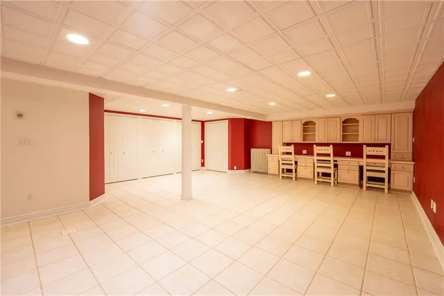 a view of a room with chairs and closet