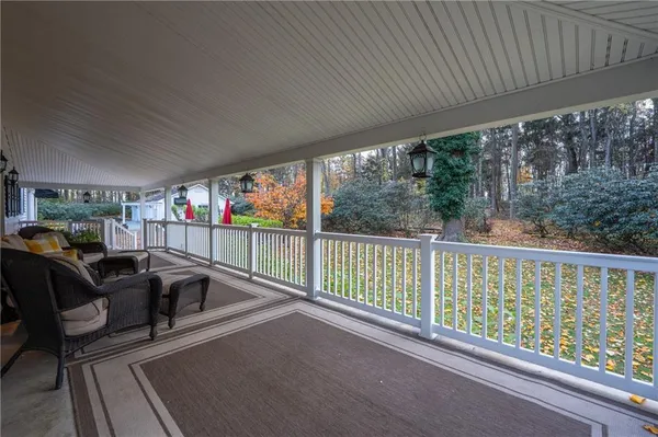 a view of a chairs and table in patio